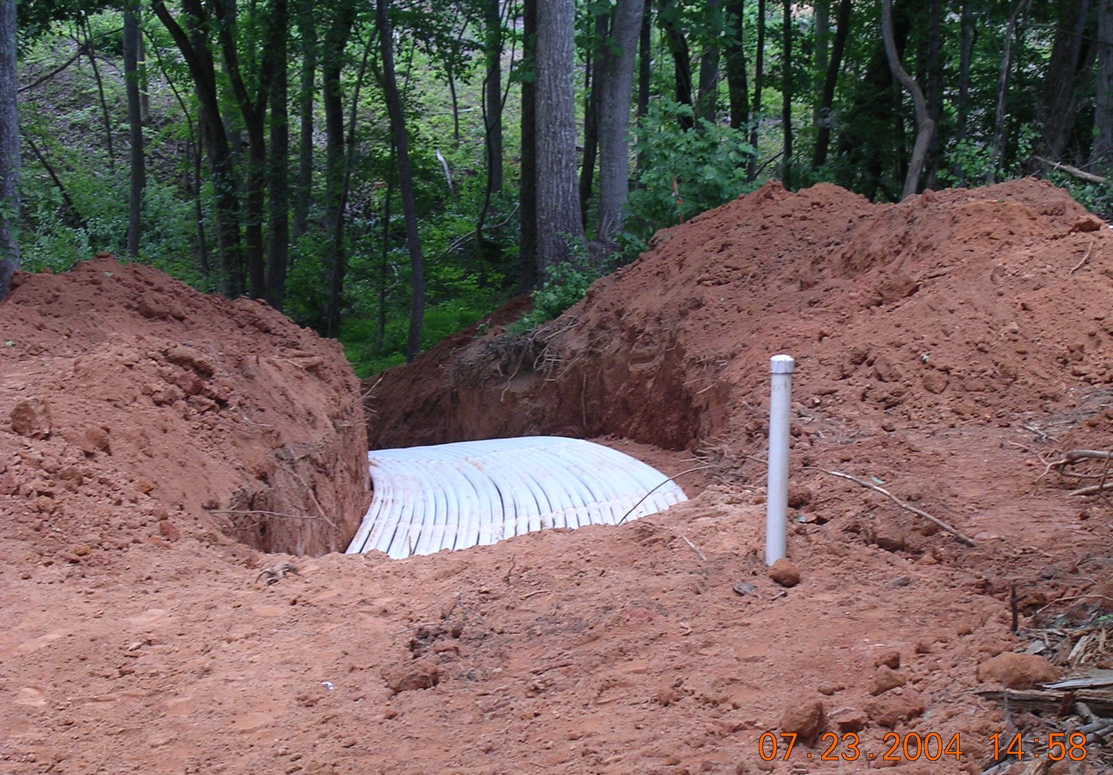 Septic system drain field installation at a rural Muskingum County property